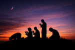 Silhouettes of five people praying at sunset with crescent moon